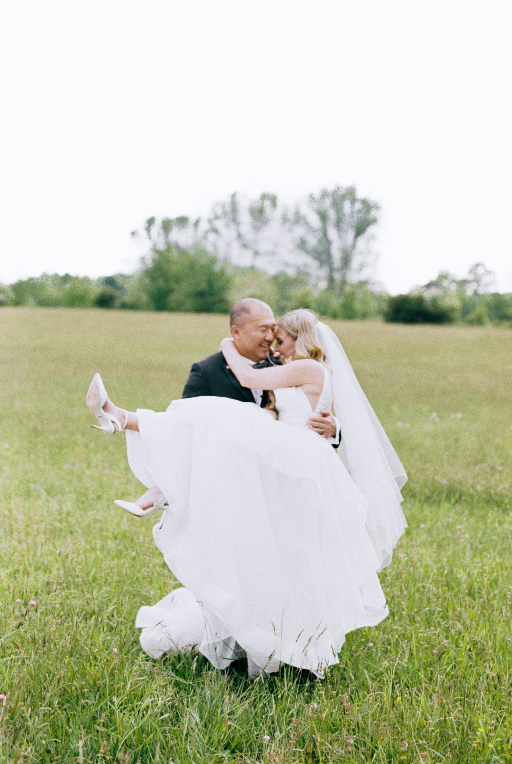 The groom picks up the bride in a field in Mentone, Alabama