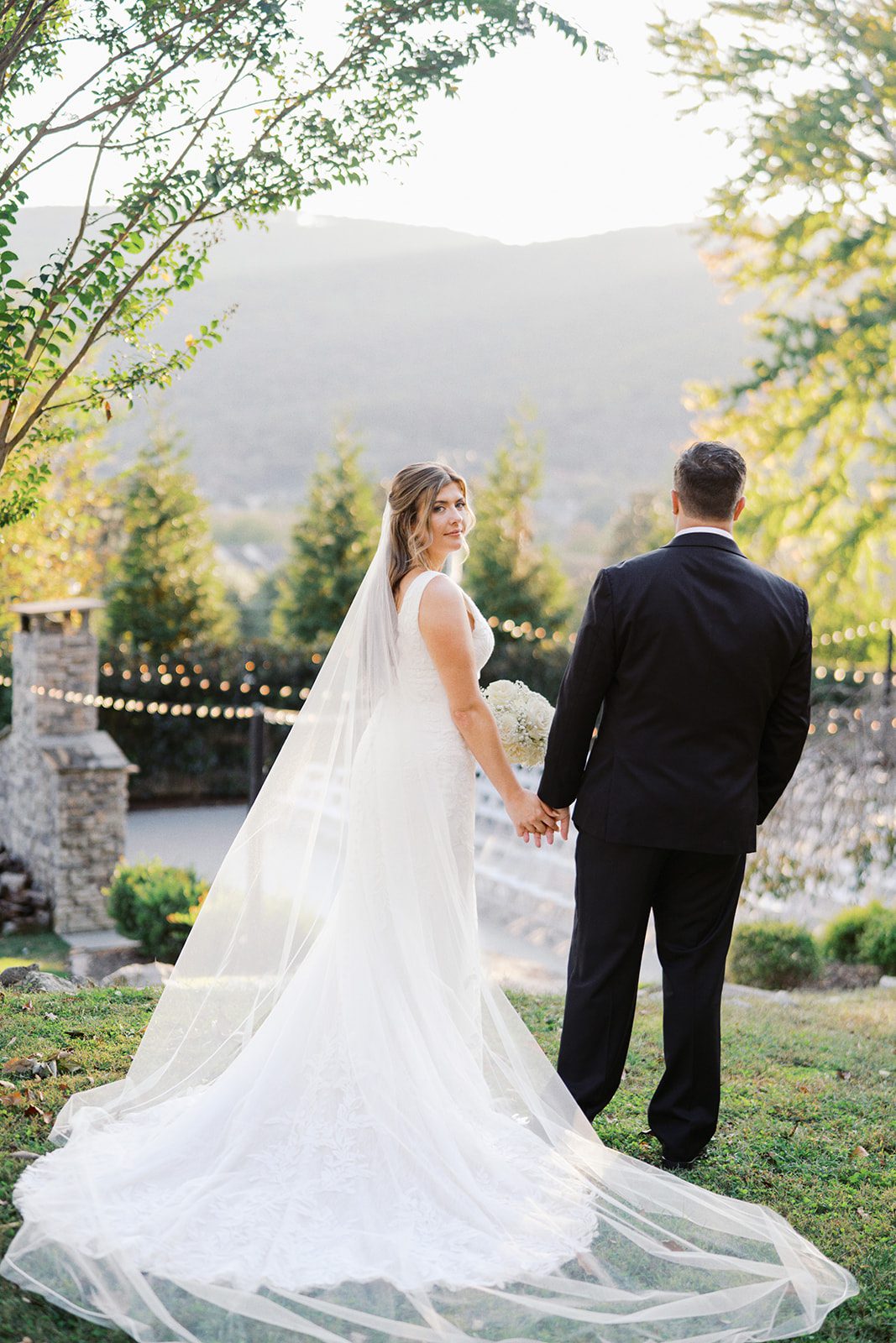 Bride and groom at the Venue Chattanooga overlooking their ceremony space and Lookout Mountain